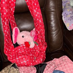 Red Designer style pet Sling Bag with harness connector safety strap